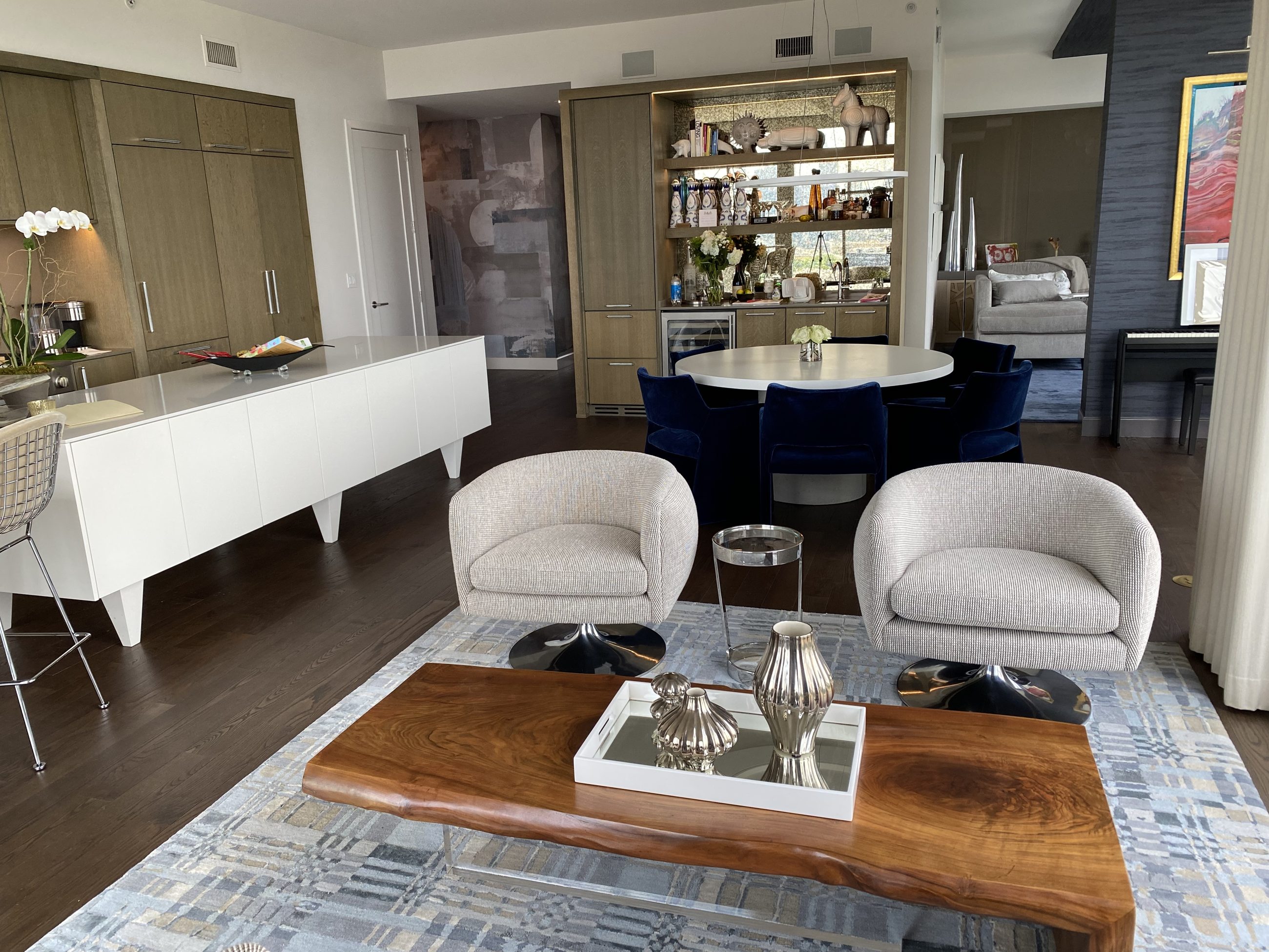 Wet bar and wine storage beside the round dining table